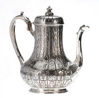 EMBOSSED AND CHASED SILVER COFFEE POT at Ross's Online Art Auctions