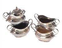 FOUR PIECE EMBOSSED SILVER CONDIMENT SET at Ross's Online Art Auctions
