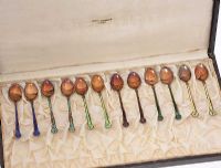 CASED SET OF 12 ENAMEL AND SILVER TEA SPOONS at Ross's Online Art Auctions