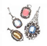 FOUR SILVER GEM AND CRYSTAL-SET PENDANTS at Ross's Online Art Auctions