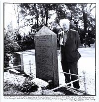 SEAMUS HEANEY AT THE GRAVE OF LOUIS MACNEICE by John Minihan at Ross's Online Art Auctions