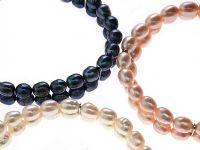 THREE FRESHWATER PEARL BRACELETS at Ross's Online Art Auctions