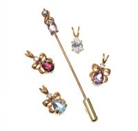 STICK PIN WITH FOUR CHARMS at Ross's Online Art Auctions