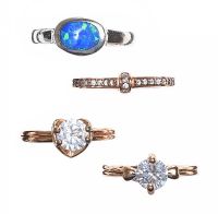 FOUR COSTUME RINGS at Ross's Online Art Auctions
