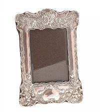 EMBOSSED SILVER PHOTOGRAPH FRAME at Ross's Online Art Auctions