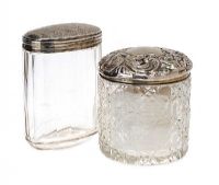 TWO ORNATE CUT GLASS SILVER TOPPED JARS at Ross's Online Art Auctions