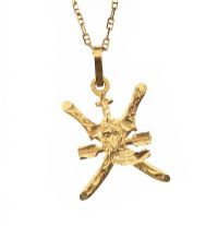 21CT GOLD PENDANT ON 9CT GOLD CHAIN at Ross's Online Art Auctions