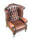 DEEP BUTTONED LEATHER WING BACK ARMCHAIR at Ross's Online Art Auctions