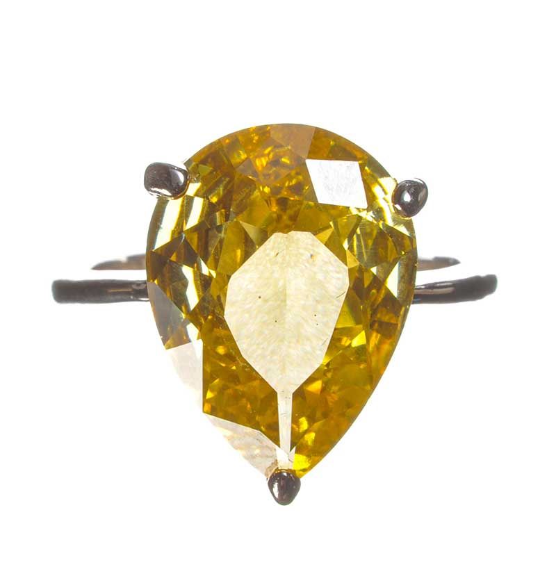 WHITE METAL AND YELLOW STONE RING at Ross's Online Art Auctions