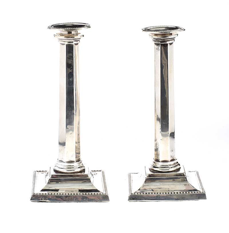 PAIR OF SILVER CANDLESTICKS COMPLETE WITH DRIP TRAYS AND LOADED BASES at Ross's Online Art Auctions