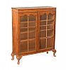 WALNUT TWO DOOR BOOKCASE at Ross's Online Art Auctions