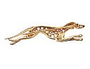 GOLD ON SILVER RUBY AND DIAMOND GREYHOUND BROOCH at Ross's Online Art Auctions
