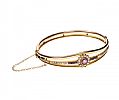 GOLD-TONE AMETHYST AND SEED PEARL BANGLE at Ross's Online Art Auctions