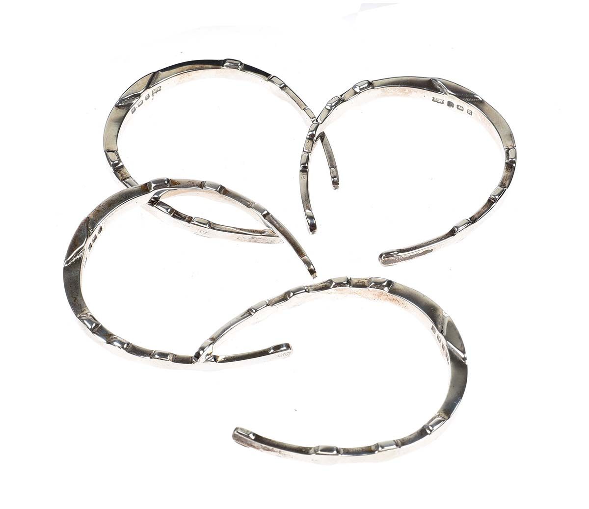 SET OF FOUR SILVER HORSESHOE NAPKIN RINGS at Ross's Online Art Auctions