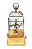 AN ANTIQUE FRENCH GILT METAL BIRDCAGE WITH A SINGING BIRD AUTOMATON at Ross's Online Art Auctions