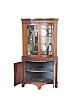 A NINETEENTH CENTURY MAHOGANY AND INLAID BOW FRONT STANDING CORNER CUPBOARD at Ross's Online Art Auctions