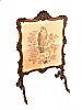 A LATE NINETEENTH CENTURY CARVED MAHOGANY FIRE SCREEN at Ross's Online Art Auctions