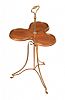 A BRASS MOUNTED SWIVEL MAHOGANY TREFOIL TABLE at Ross's Online Art Auctions