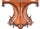 A NINETEENTH CENTURY MAHOGANY HANGING SHELF ON DOLPHIN SUPPORTS at Ross's Online Art Auctions
