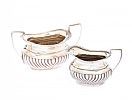 A SILVER CREAM JUG AND MATCHING SUGAR BASIN at Ross's Online Art Auctions